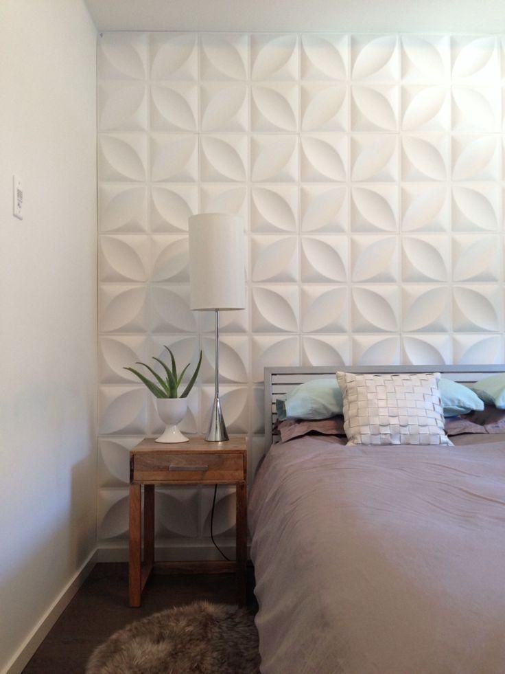 Premium white 3D wall panels behind a bedside setup